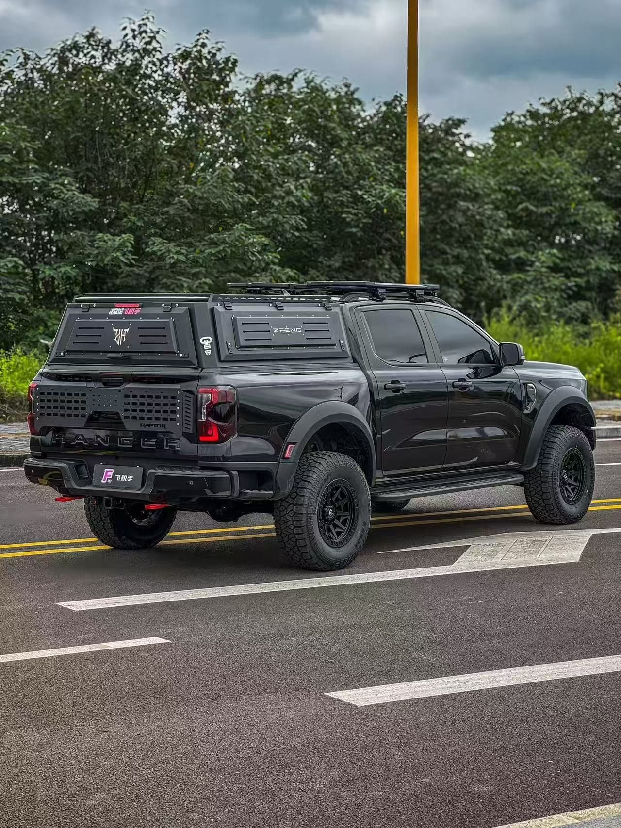Black pickup with aluminium hardtop canopy and roof rack